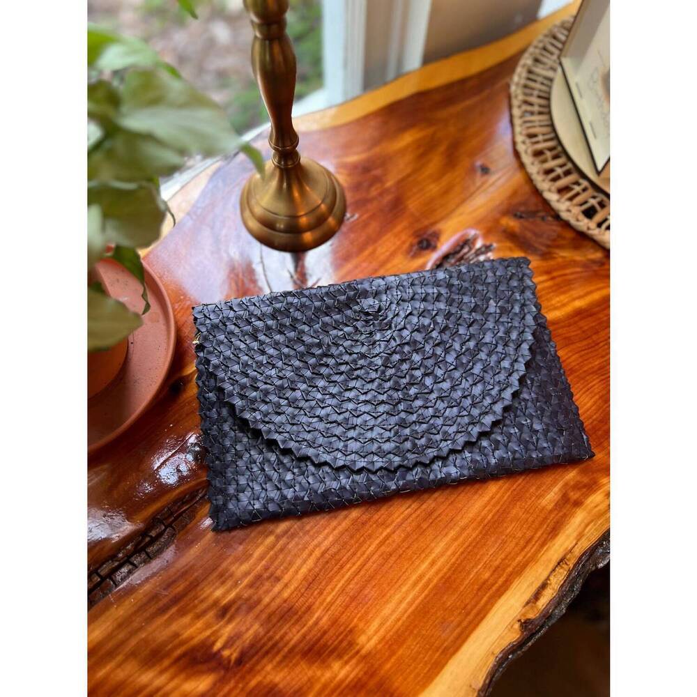 NEW VILLAGE THRIVE women's rattan clutch in black